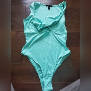 Teal bodysuit size medium by Forever21.  Super cute detail and neck line